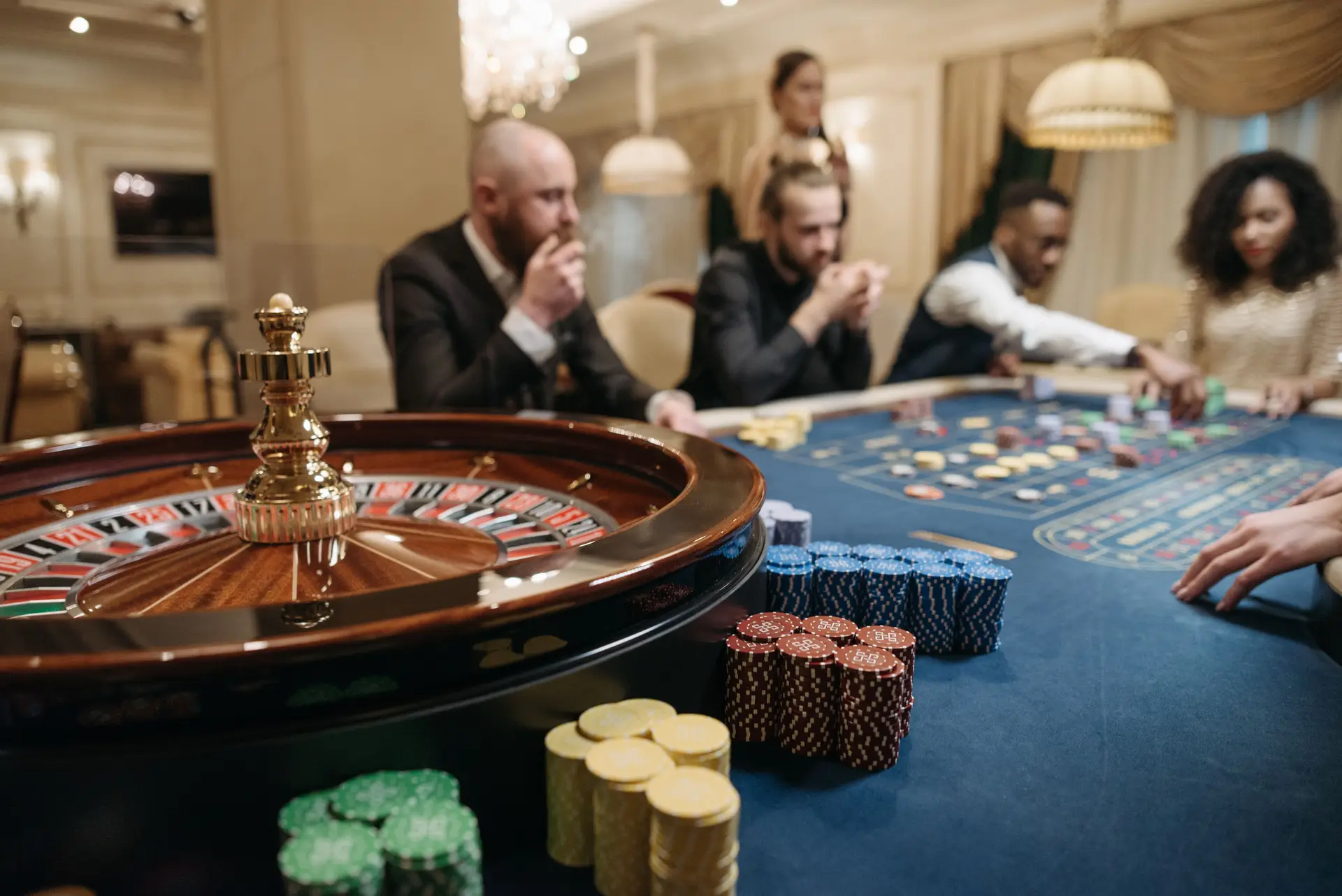 Atmospheric casino table with roulette wheel at night